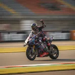 Ai Ogura celebrates as he crosses the finish line on his SuperFile Trackhouse MotoGP Team Aprilia to win the Dutch Grand Prix.