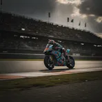 A MotoGP rider leans their bike at an extreme angle through a fast corner at the Sachsenring circuit in Germany.
