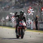 Jorge Martin celebrates his Sprint race victory at the Austrian Grand Prix, punching the air as he crosses the finish line.