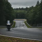 Marc Marquez celebrates his victory on his motorcycle after finishing the German Grand Prix.