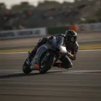 Marc Marquez celebrates his victory on his motorcycle after finishing the German Grand Prix.