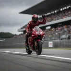 A MotoGP rider crosses the finish line at Motegi to win the Sprint.