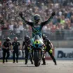 Marco Bezzecchi celebrating one of his four 2026 victories with his Aprilia MotoGP bike.