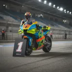 A MotoGP bike with the number one board in front of it, indicating it has secured pole position for the race.