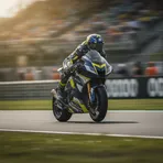 The front wheel of a MotoGP bike is seen in sharp focus as it lines up on the starting grid before a race.