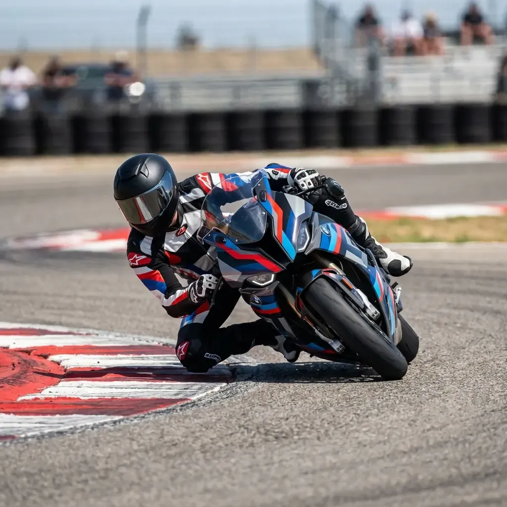 A wide, photorealistic shot of a MotoGP bike and rider sliding at high speed into a vast gravel trap at the edge of a ra