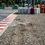 Illustration for our Indonesian GP practice report: a gravel run-off trap beside the circuit kerbing.