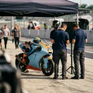 Illustration for our Indonesian GP qualifying story: a racing motorbike resting in the pit lane during a break in track action